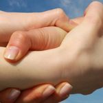 Image of three interlocking hands