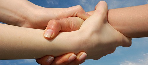 Image of three interlocking hands